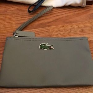 Grey Lacoste wristlet..